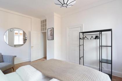 Rare 4BR Apartment w Unique Details in CPH City - image 20